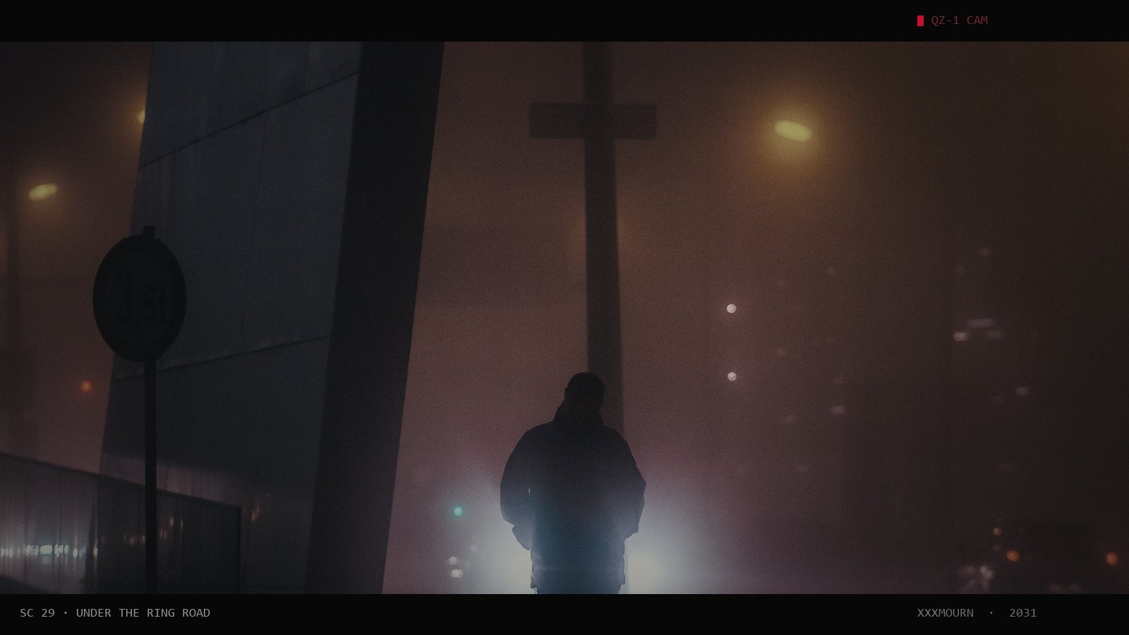 A man walking under a bridge in thick fog, street lamps glowing behind him