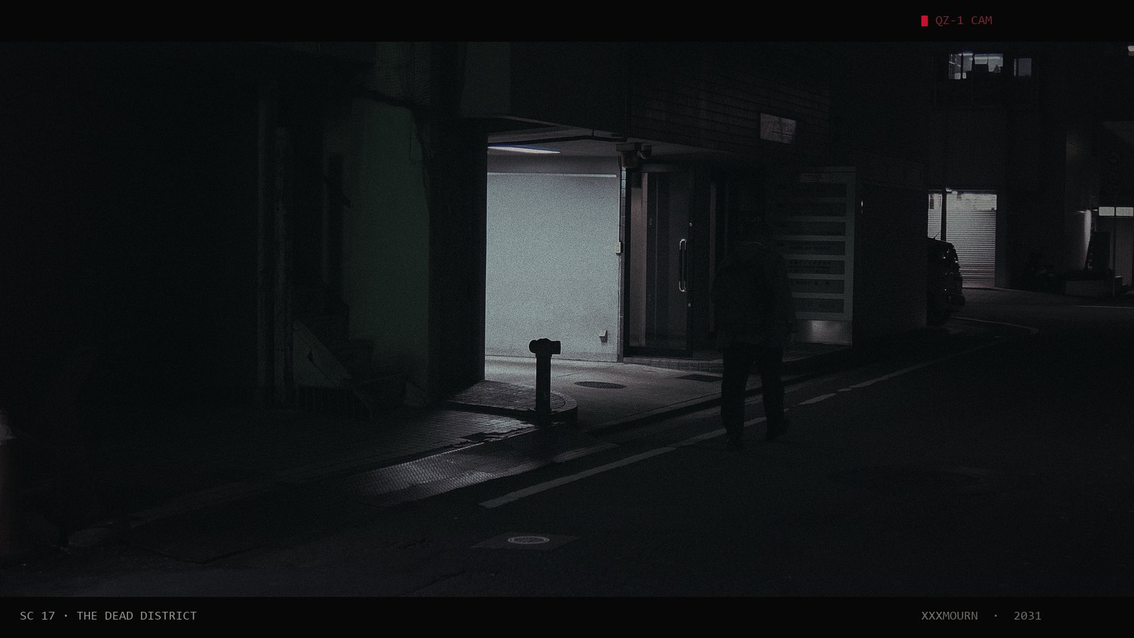 A lone figure walking down a dark narrow street past a lit doorway